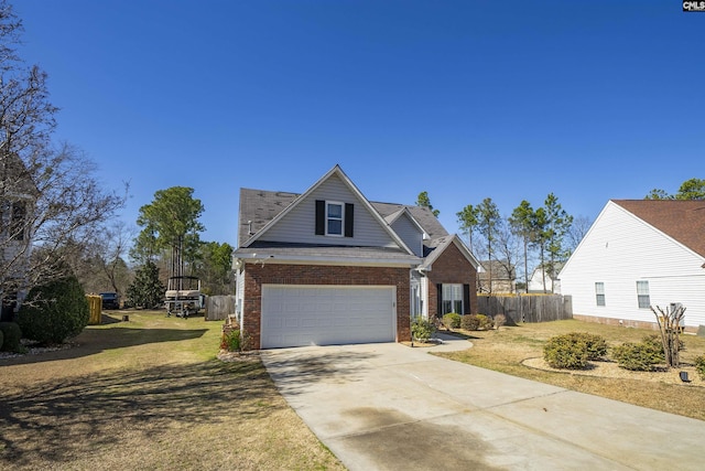 view of front of home with a garage, brick siding, fence, driveway, and a front yard