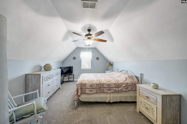 carpeted bedroom featuring vaulted ceiling, ceiling fan, and visible vents