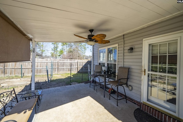 view of patio / terrace featuring ceiling fan and fence