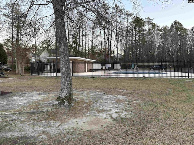 view of yard featuring a fenced in pool and fence