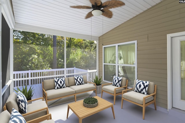 sunroom with vaulted ceiling and a ceiling fan