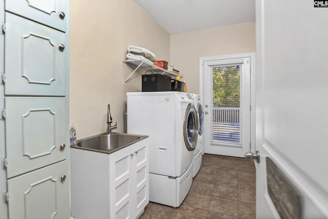 washroom featuring washer and clothes dryer and a sink