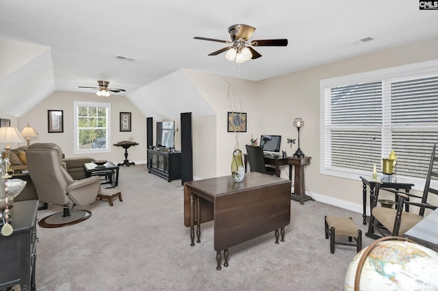 office with light carpet, visible vents, and vaulted ceiling