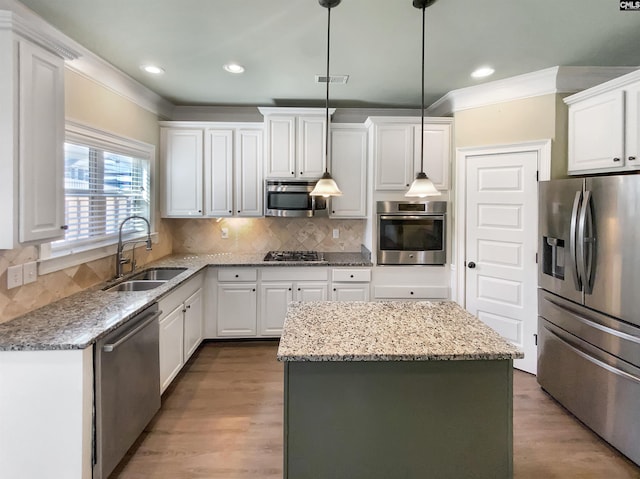 150 Grey Oaks Ln, Lexington, SC 29072 - kitchen featuring a center island, stainless steel appliances, visible vents, white cabinetry, and a sink
