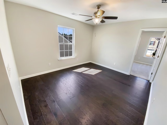 interior space with ceiling fan, baseboards, and dark wood-style flooring