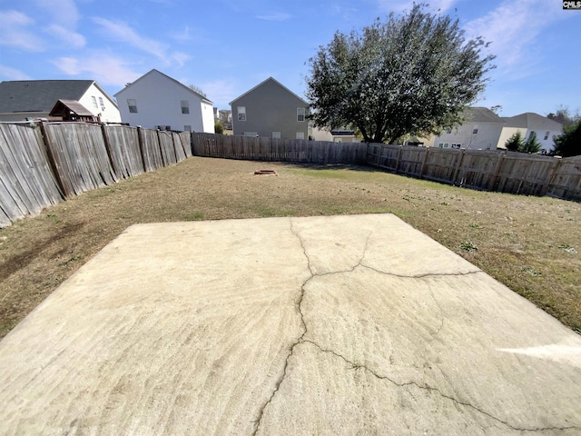 exterior space with a fenced backyard and a residential view