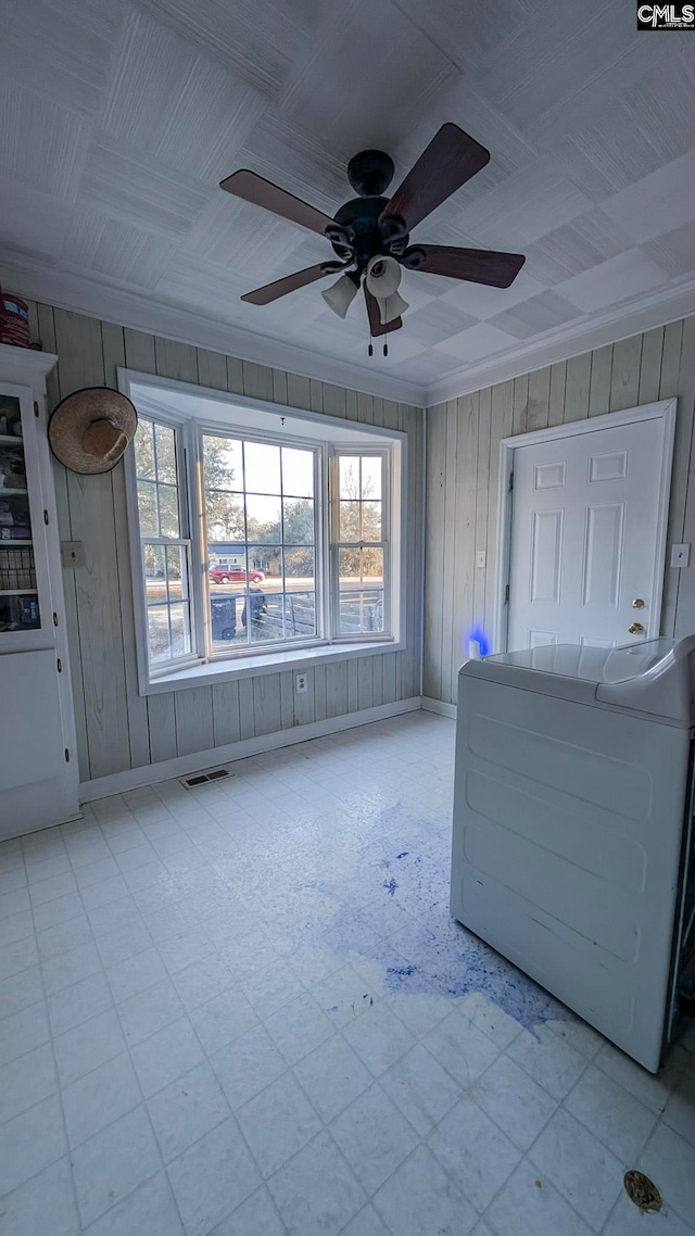 interior space with washer / dryer, a healthy amount of sunlight, visible vents, and tile patterned floors