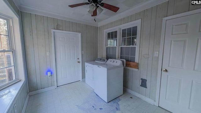 laundry area with light floors, ornamental molding, ceiling fan, separate washer and dryer, and laundry area