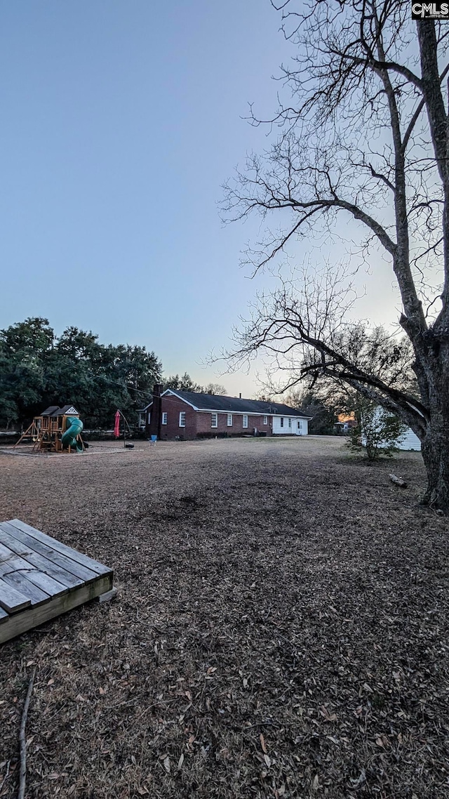 view of yard featuring a playground