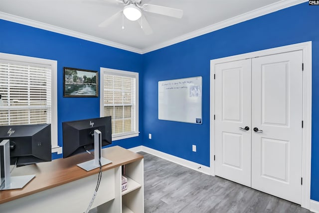 home office featuring baseboards, a ceiling fan, crown molding, and wood finished floors