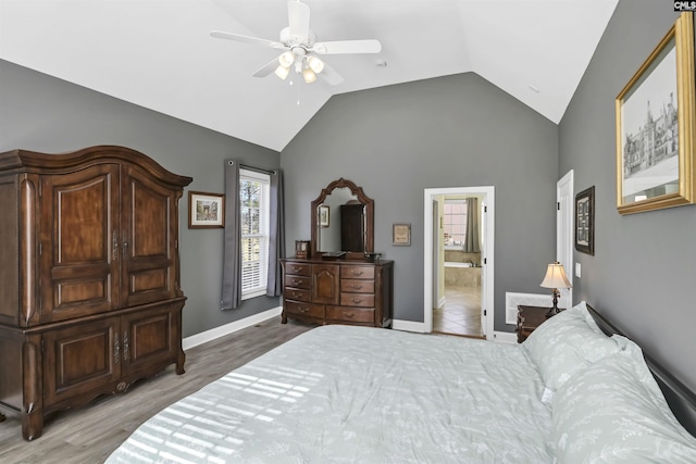 bedroom with lofted ceiling, a ceiling fan, baseboards, and wood finished floors