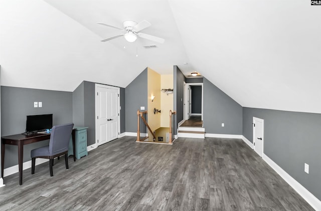 bonus room featuring dark wood-style flooring, visible vents, vaulted ceiling, and baseboards