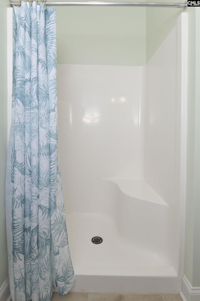 bathroom with curtained shower