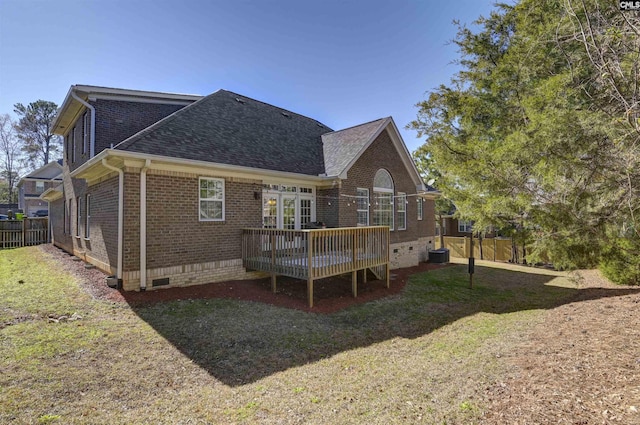 back of house featuring brick siding, a shingled roof, crawl space, fence, and a deck