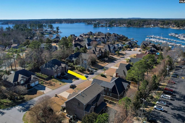 aerial view featuring a water view and a residential view