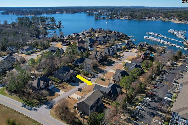 aerial view featuring a residential view and a water view