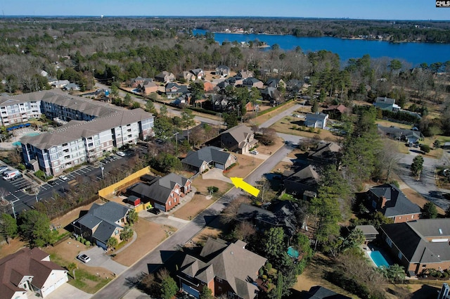 drone / aerial view with a water view and a residential view