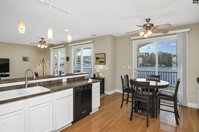 547 Harbor Heights Dr, Lexington, SC 29072 - kitchen featuring dark countertops, a wealth of natural light, black dishwasher, and a sink