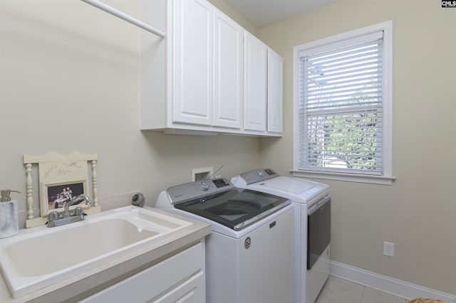 547 Harbor Heights Dr, Lexington, SC 29072 - laundry room with light tile patterned floors, a sink, baseboards, washer and dryer, and cabinet space