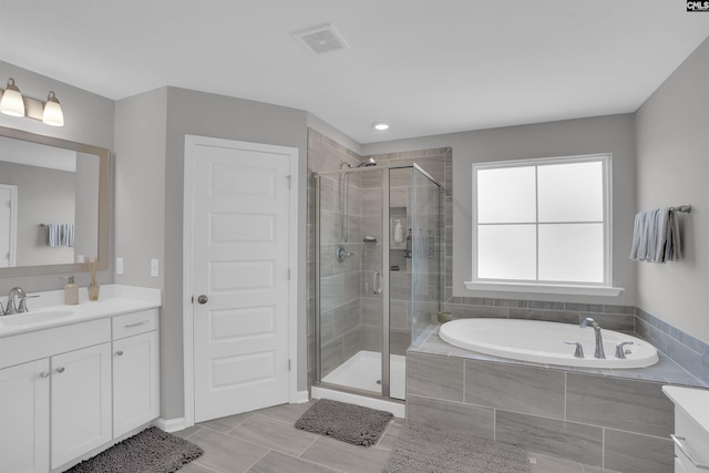 full bath featuring a shower stall, visible vents, a bath, and vanity