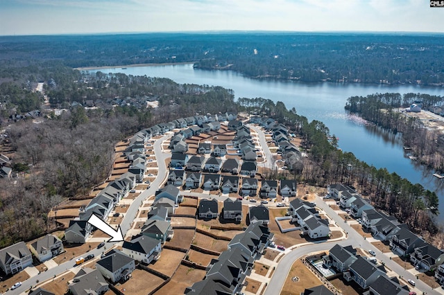 birds eye view of property with a water view and a residential view