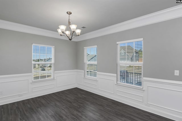 unfurnished room with a chandelier, dark wood-style flooring, wainscoting, and visible vents