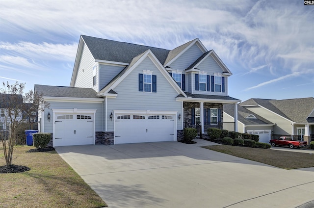 craftsman-style home featuring roof with shingles, a porch, concrete driveway, an attached garage, and stone siding