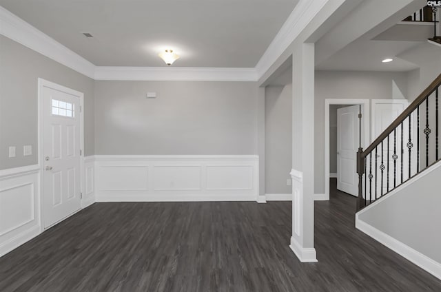 entryway featuring crown molding, visible vents, stairway, dark wood-type flooring, and wainscoting