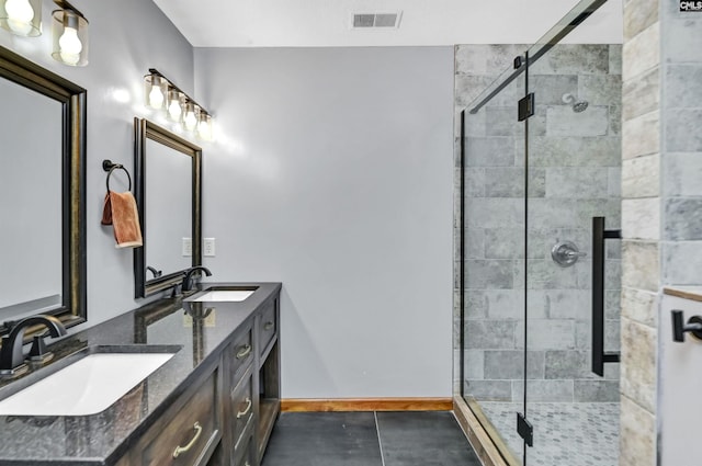 full bathroom with a sink, visible vents, and a shower stall