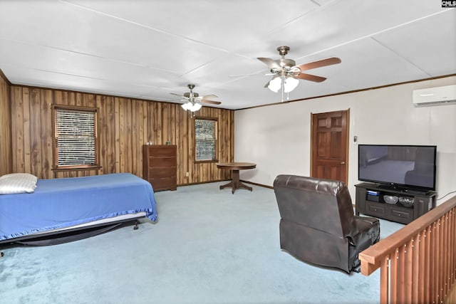 carpeted bedroom with ceiling fan, wooden walls, baseboards, a wall mounted AC, and crown molding