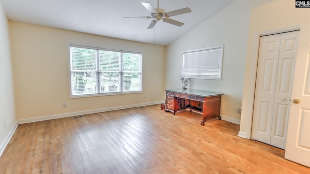 bedroom with visible vents, ceiling fan, baseboards, light wood finished floors, and high vaulted ceiling