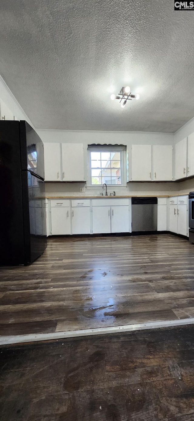 kitchen with dishwasher, dark wood-type flooring, freestanding refrigerator, and white cabinetry