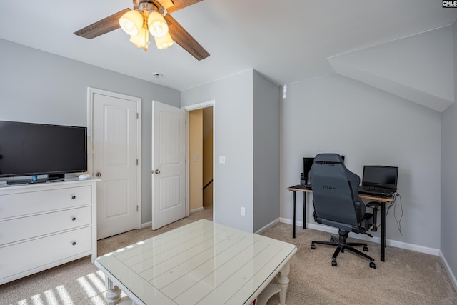 office area with light carpet, ceiling fan, and baseboards