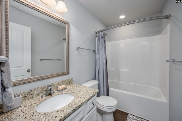 bathroom with toilet, recessed lighting, shower / tub combo, wood finished floors, and vanity