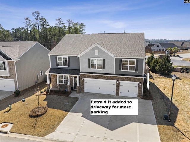 traditional-style house with a garage, driveway, and a shingled roof