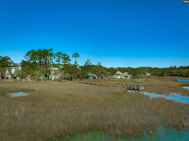 view of community with a water view