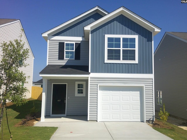 view of front of property with a garage, concrete driveway, and board and batten siding