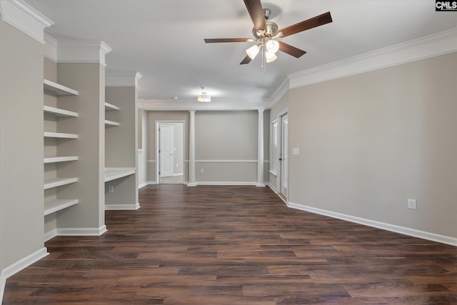 spare room with a ceiling fan, baseboards, ornamental molding, dark wood-style floors, and decorative columns