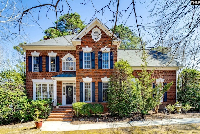 view of front of house with brick siding