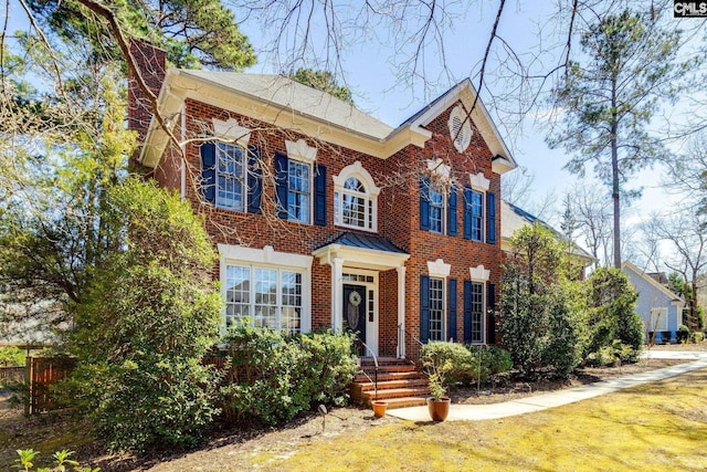 colonial house with brick siding