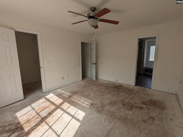 unfurnished bedroom with ceiling fan and ensuite bath