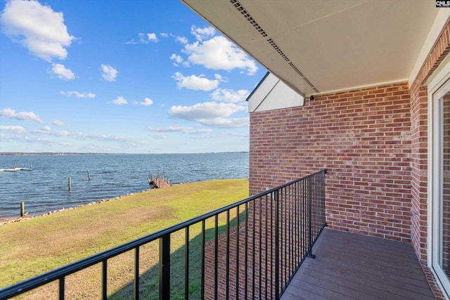 balcony featuring a water view