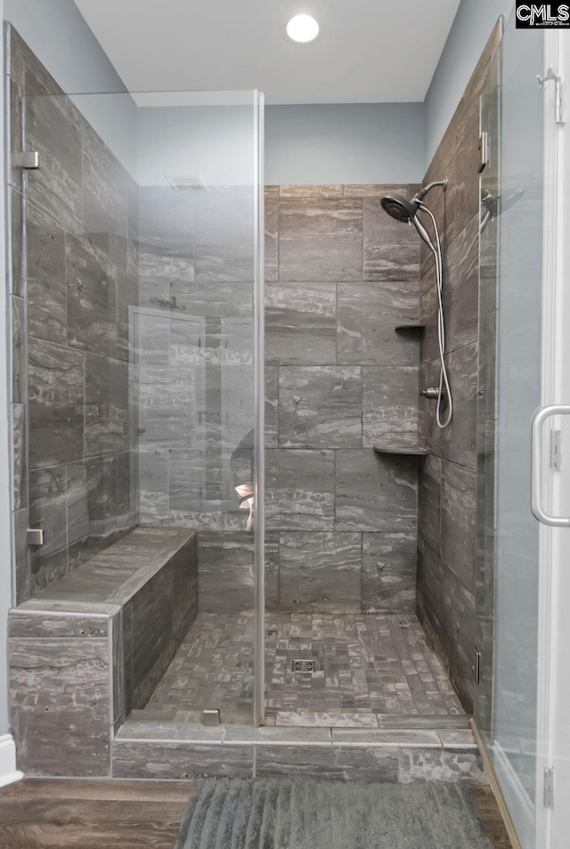 full bath featuring a shower stall