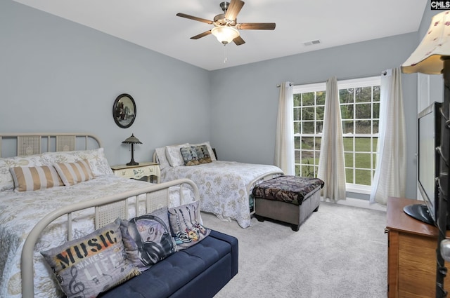 bedroom featuring ceiling fan, carpet flooring, and visible vents