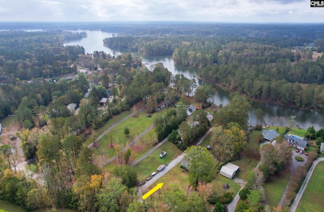 aerial view featuring a forest view and a water view