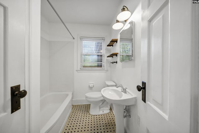 full bath featuring toilet, tile patterned floors, baseboards, and shower / bathtub combination