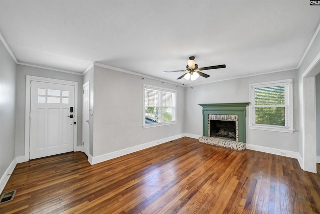 unfurnished living room with a brick fireplace, wood-type flooring, and baseboards