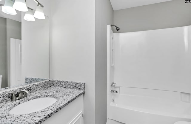 full bath featuring shower / washtub combination and vanity