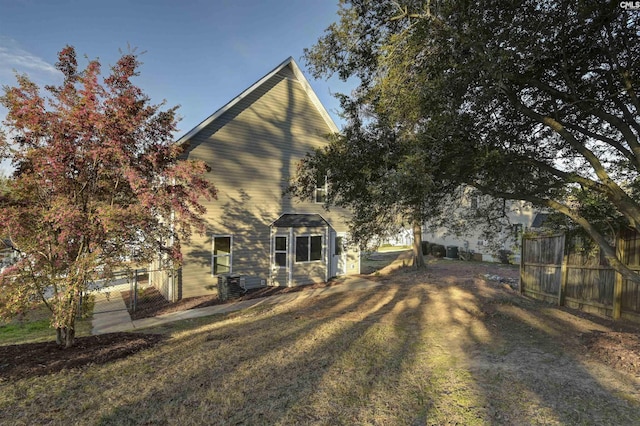 back of property featuring fence