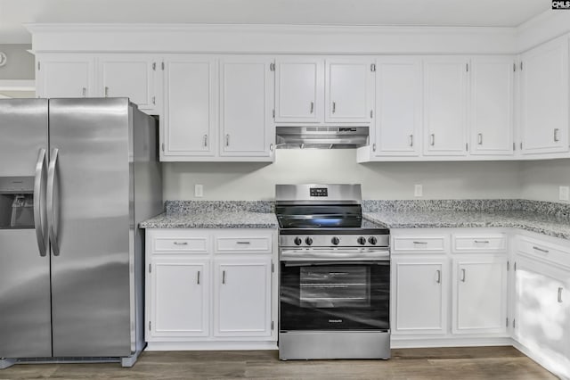 kitchen featuring white cabinets, dark wood finished floors, light stone counters, stainless steel appliances, and under cabinet range hood